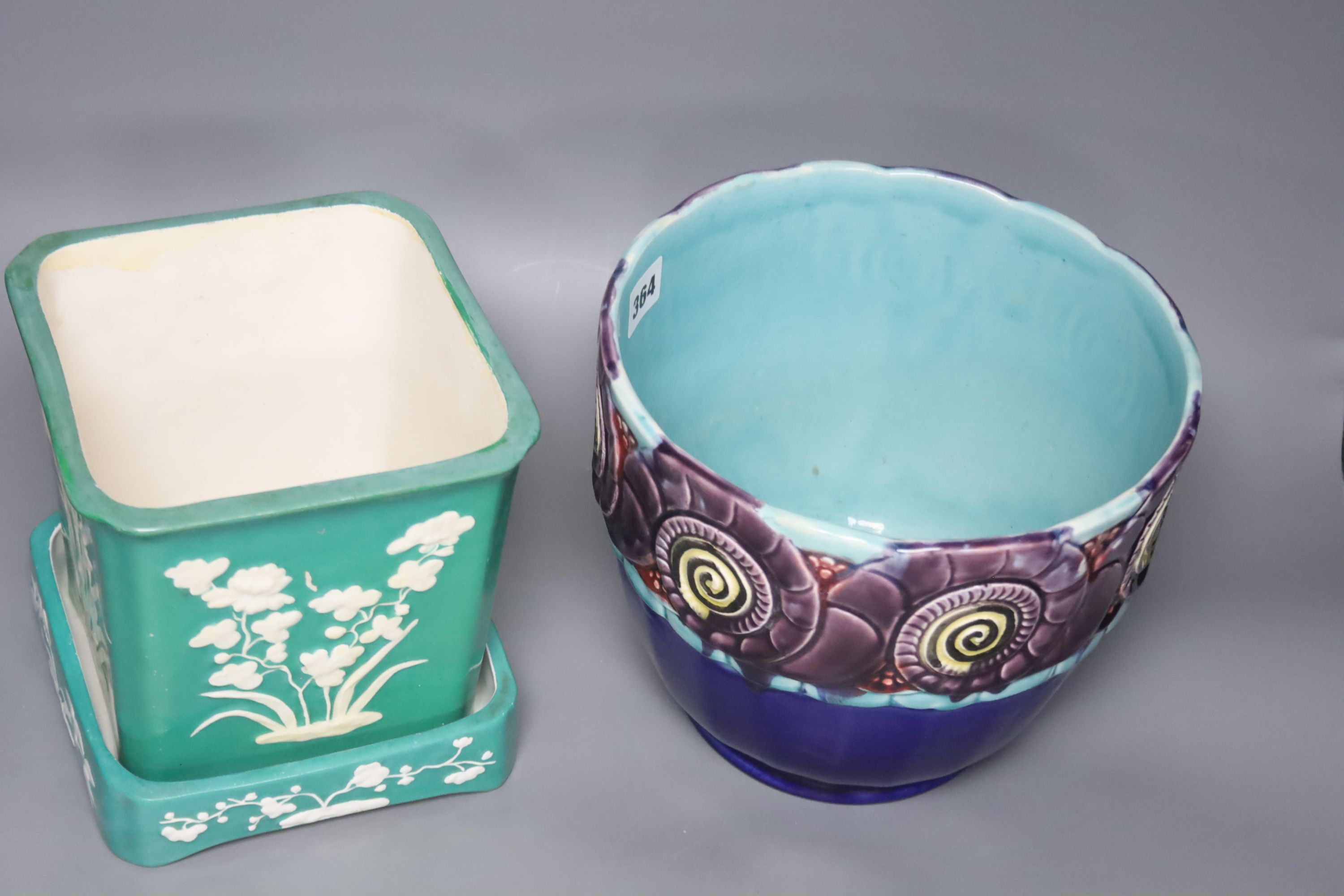 An Orchies majolica jardiniere and a Minton green glazed flower pot and stand